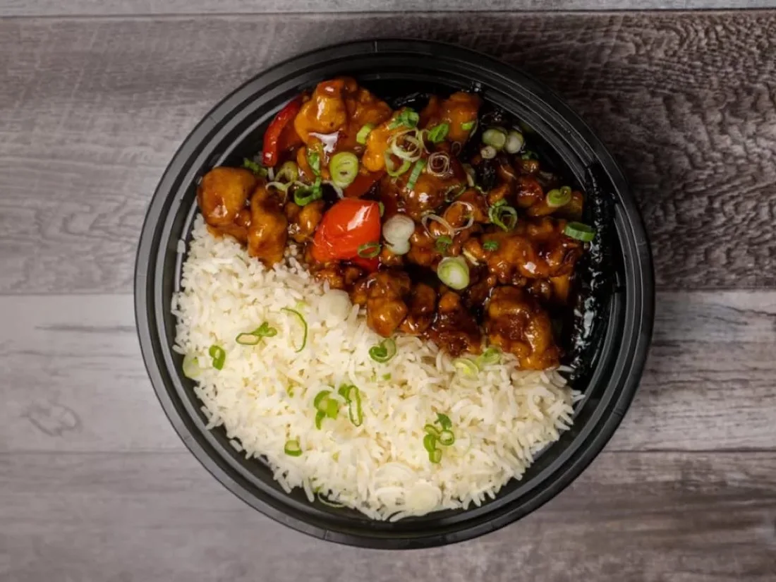 Individually boxed halal office lunch — General Tso's chicken and rice — from Wok & Karahi, Spring TX