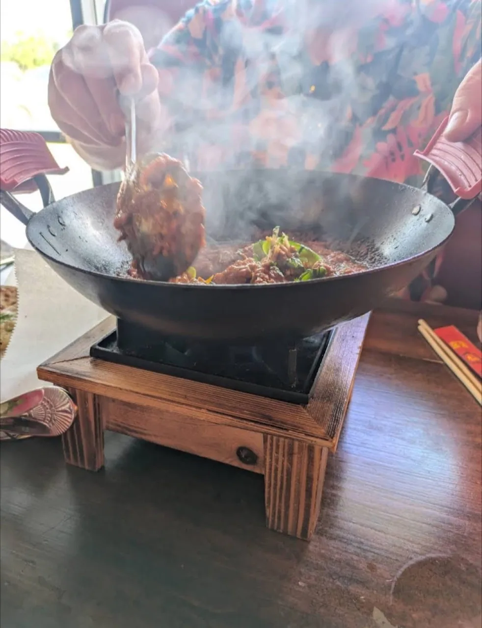 Wok-firing over high heat for wok hei — the smoky char behind every Indo-Chinese dish at Wok & Karahi, Spring TX
